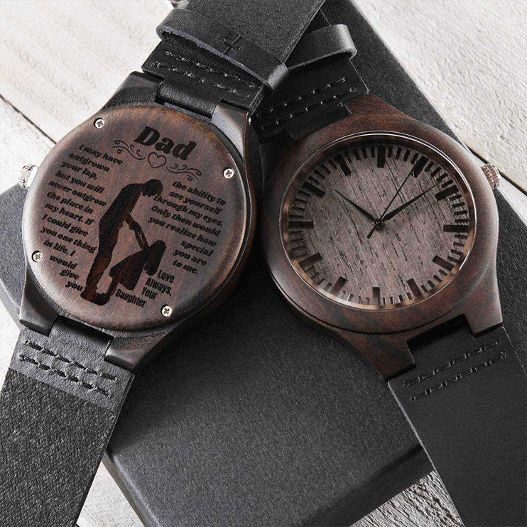 wooden watch engraved 2 watches showing front and back on top of a soft box