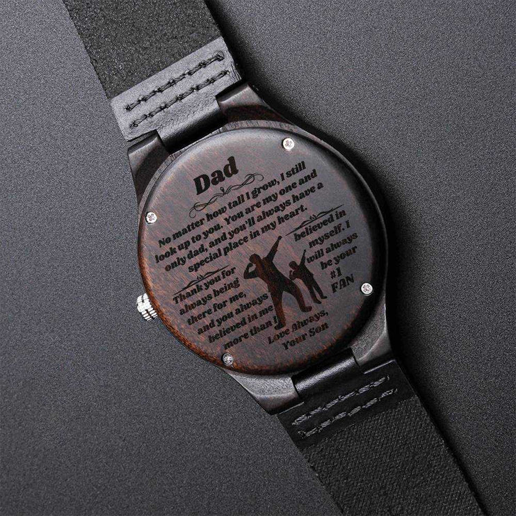 wooden watch engraved on a black background