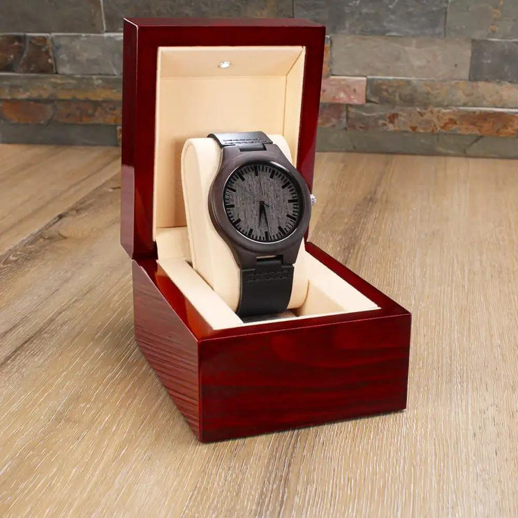 Engraved Wooden Watch in a mahogany box angled to left