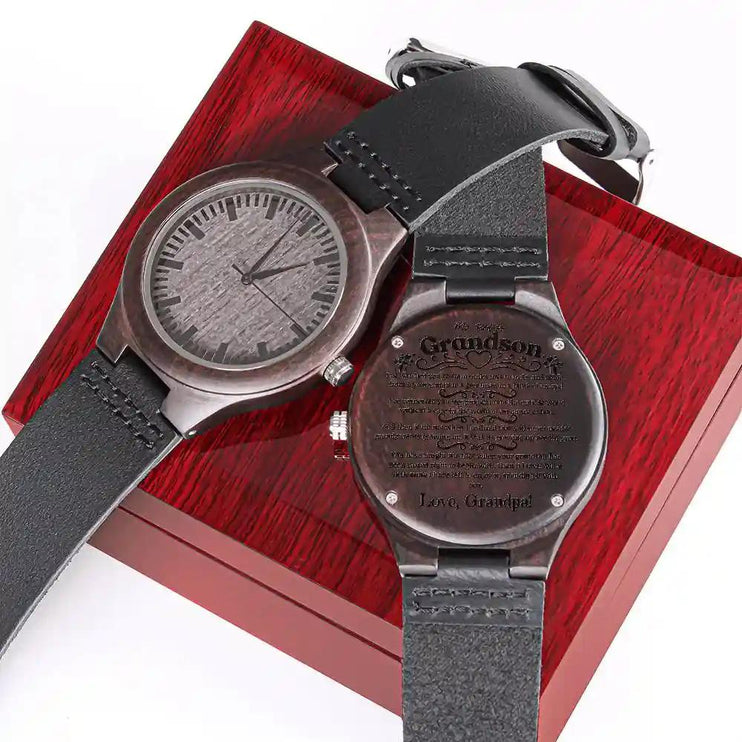 2 engraved wooden on watch on top a mahogany box face down and face up