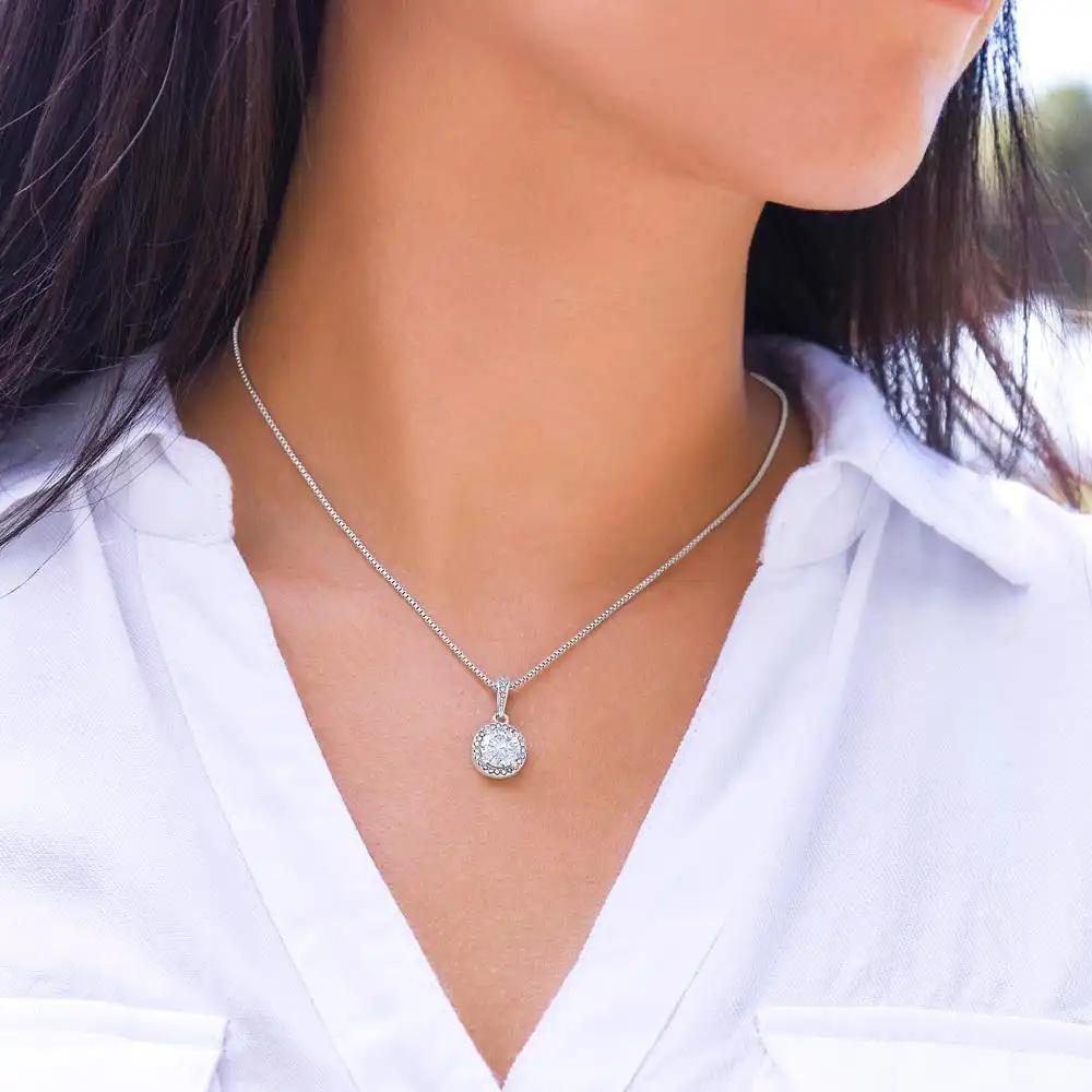 white gold eternal hope necklace on a model's neck