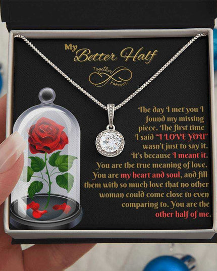 eternal hope necklace in a soft box in a model's hand
