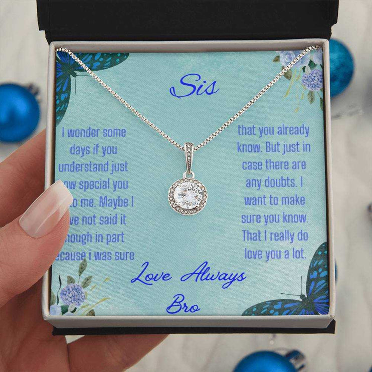 Eternal Hope Necklace on a To Sis from Bro greeting card in a two-tone box in the hands of a model