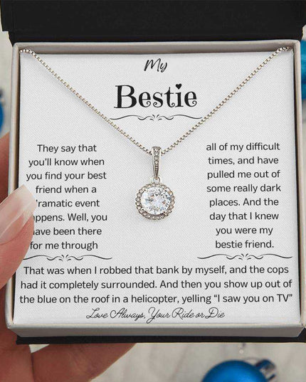 a eternal hope necklace up close in a models hand