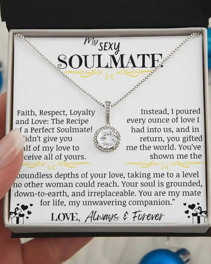 a eternal hope necklace up close in models hands.
