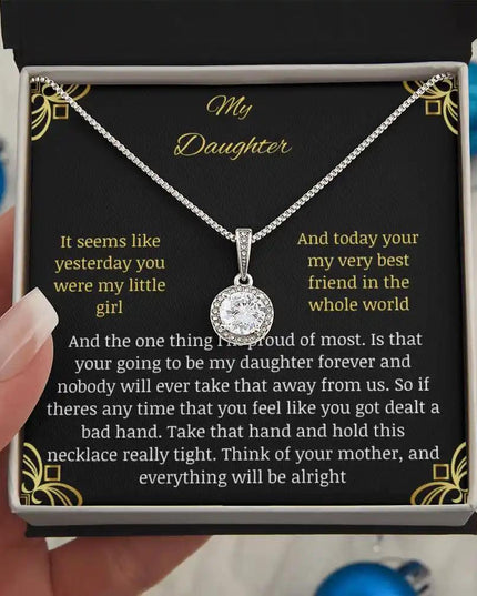 Eternal Hope Necklace in a two-tone box held away in models hand