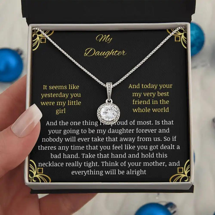 Eternal Hope Necklace in a two-tone box held away in models hand