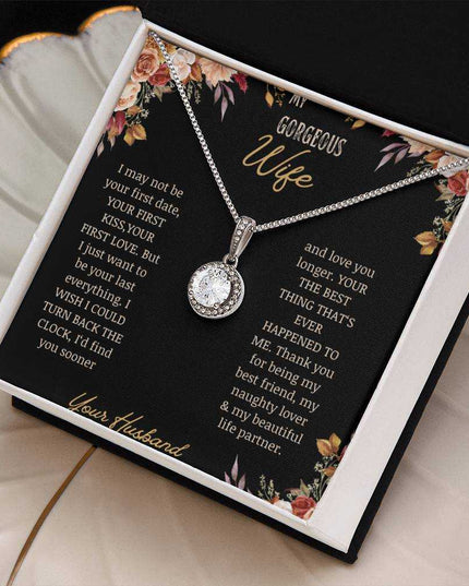 A white gold Eternal Hope Necklace on a to wife greeting card on a coffee filter