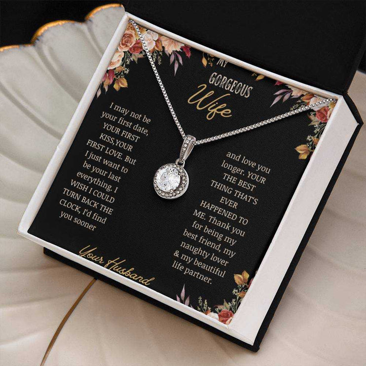 A white gold Eternal Hope Necklace on a to wife greeting card on a coffee filter