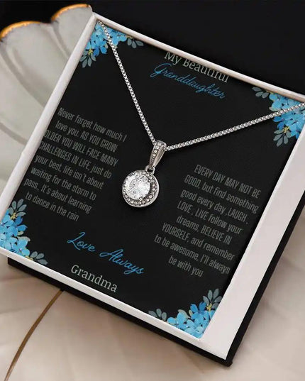 Eternal Hope Necklace with a to granddaughter from grandpa greeting card in a two-tone box on a white coffee filter