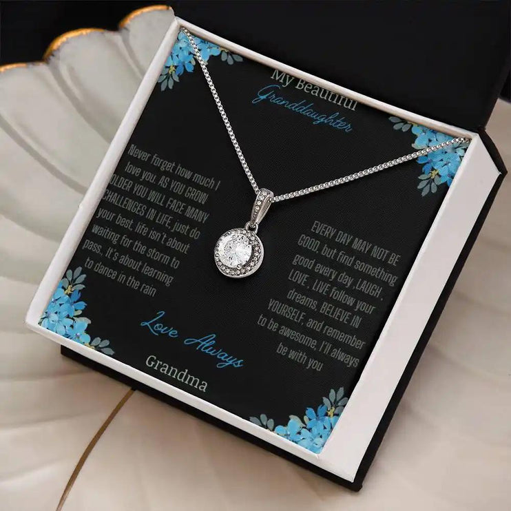 Eternal Hope Necklace with a to granddaughter from grandpa greeting card in a two-tone box on a white coffee filter