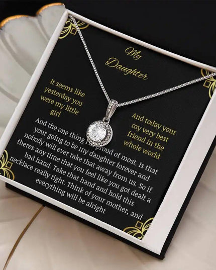 Eternal Hope Necklace in a two-tone box on a coffee filter angled to the left