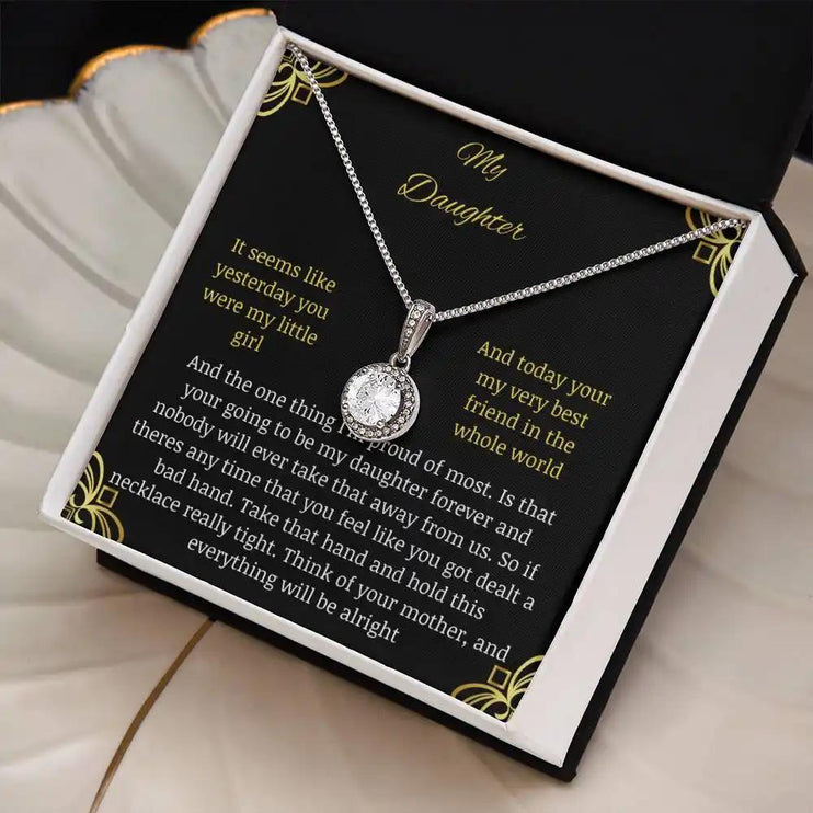 Eternal Hope Necklace in a two-tone box on a coffee filter angled to the left