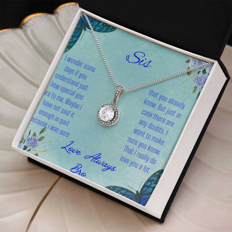 Eternal Hope Necklace on a To Sis from Bro greeting card in a two-tone box on a white coffee filter angled to the right