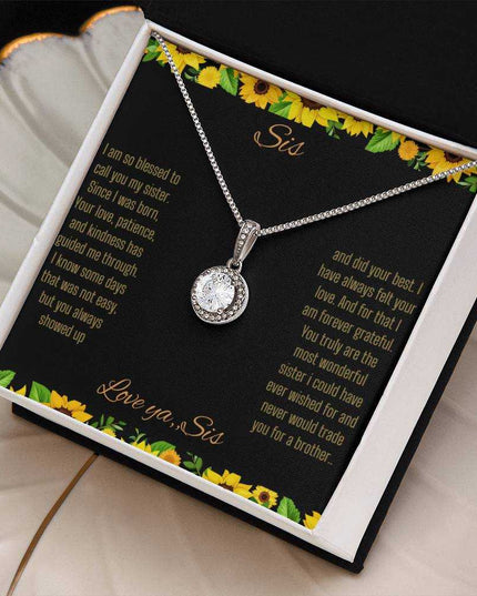 Eternal Hope Necklace on a To Sis from Sis greeting card in a two-tone box angled to the right sitting on a coffee filter.