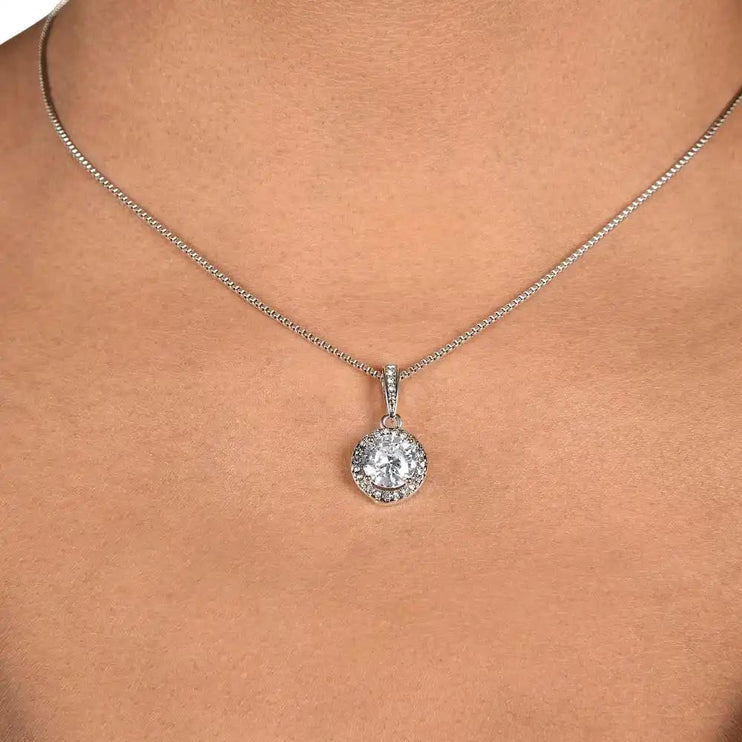 white gold eternal hope necklace on a models neck