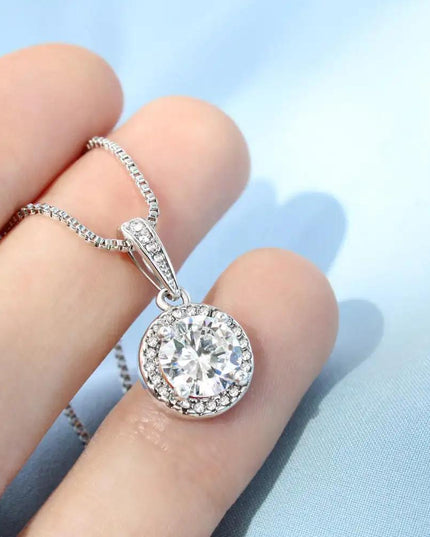 white gold eternal hope necklace in model's hand