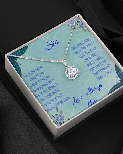 Eternal Hope Necklace on a To Sis from Bro greeting card in a two-tone box on a black background angled to the left side