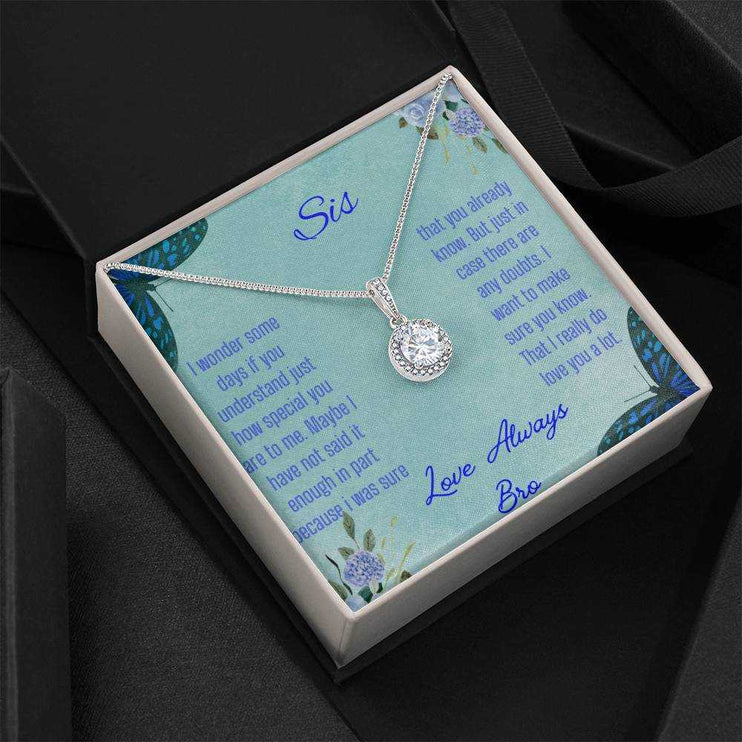 Eternal Hope Necklace on a To Sis from Bro greeting card in a two-tone box on a black background angled to the left side