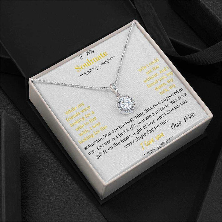 A eternal hope necklace up close in a two-tone box angled left