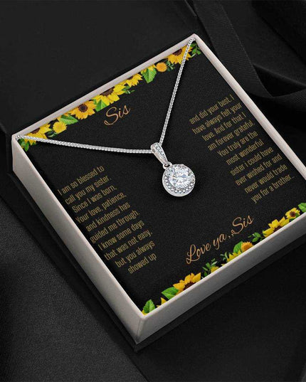 Eternal Hope Necklace on a To Sis from Sis greeting card in a two-tone box sitting on a black back drop close up view.