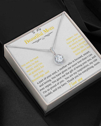 A white gold eternal hope necklace close up in a two-tone box angled to the left