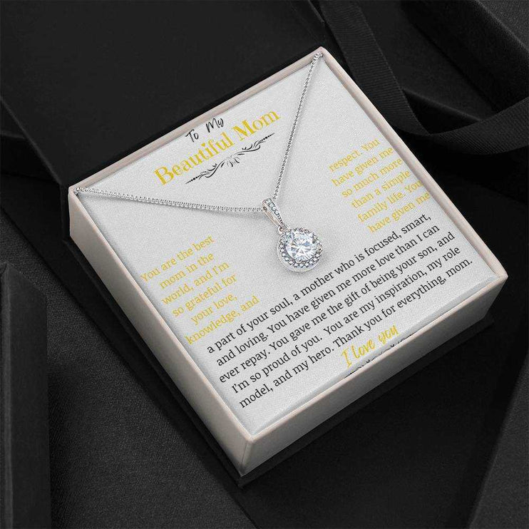 A white gold eternal hope necklace close up in a two-tone box angled to the left