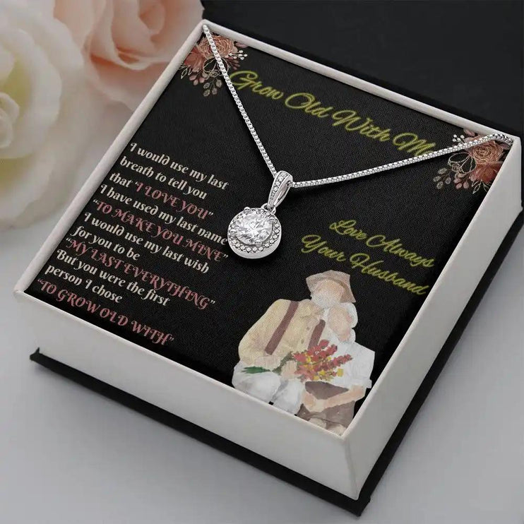 white gold eternal hope necklace in a two-tone box angled right