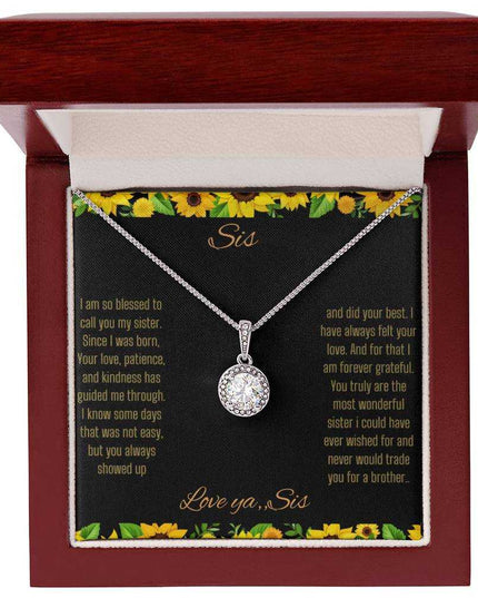 Eternal Hope Necklace on a To Sis from Sis greeting card in a mahogany box close up view.