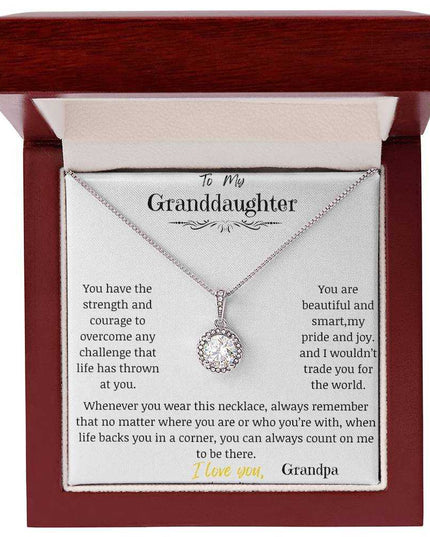a white gold eternal hope necklace up close in a mahogany box