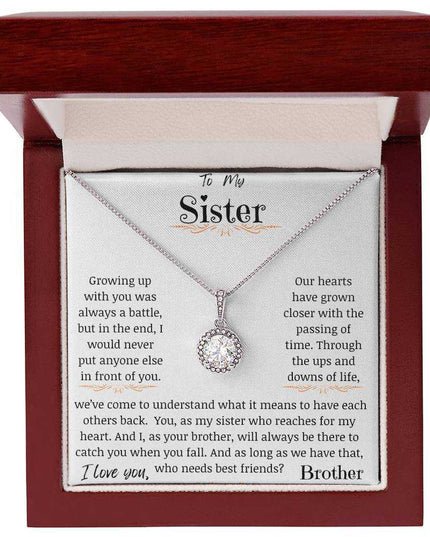 a eternal hope necklace up close in a mahogany box
