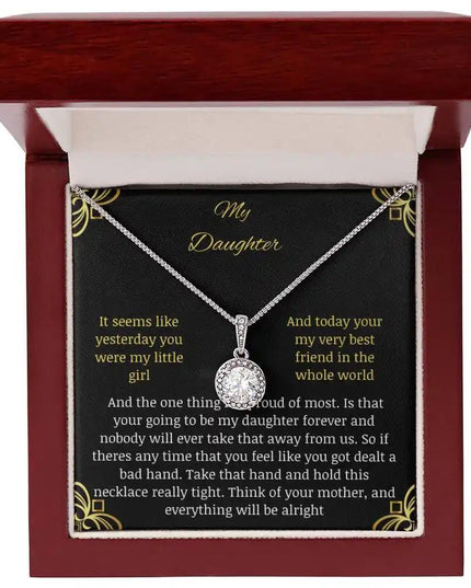 Eternal Hope Necklace in a mahogany box with a to daughter from mom greeting card looking straight down on white background