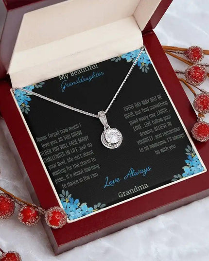 Eternal Hope Necklace with a to granddaughter from grandpa greeting card in a mahogany box on a white coffee filter angled to the right side