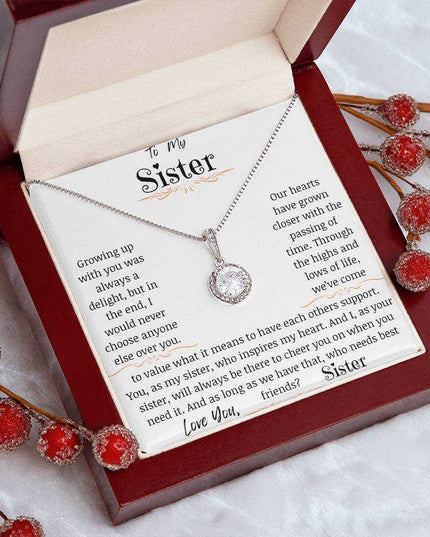 a eternal hope necklace up close in a mahogany box on a coffee filter angled left