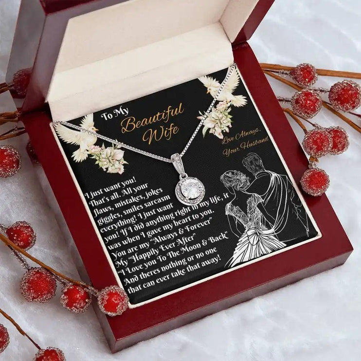 white gold eternal hope necklace in a mahogany box angled left