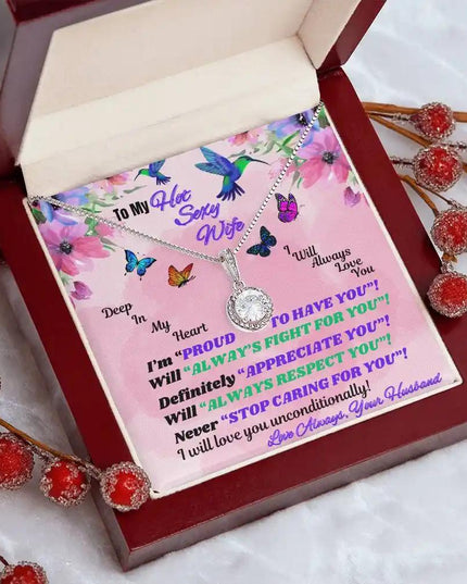 white gold eternal hope necklace in mahogany box angled left