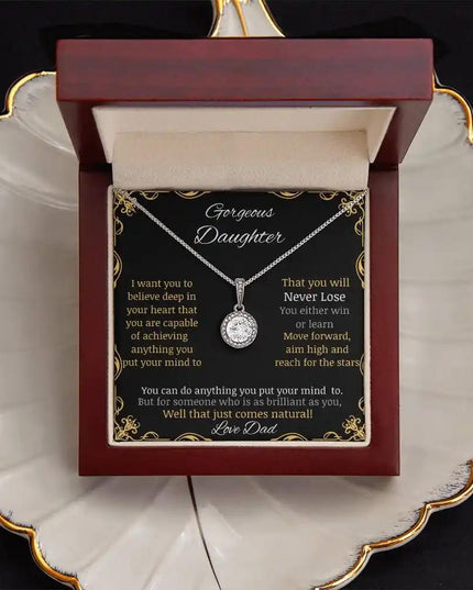 eternal hope necklace with a white gold charm in a mahogany box angle 2