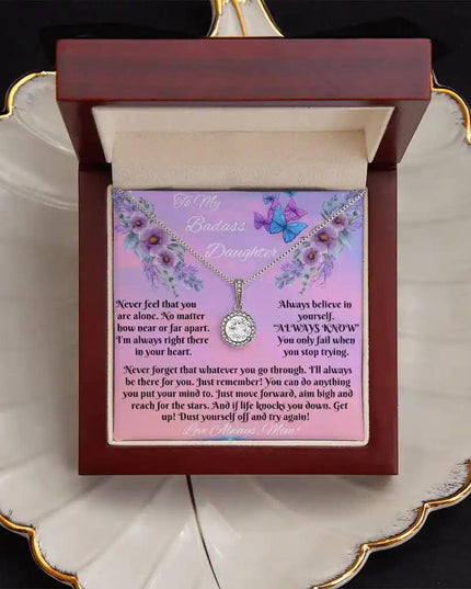 white gold eternal hope necklace in a mahogany box top view
