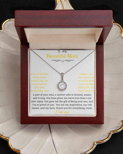 A white gold eternal hope necklace close up in a mahogany box on a coffee filter