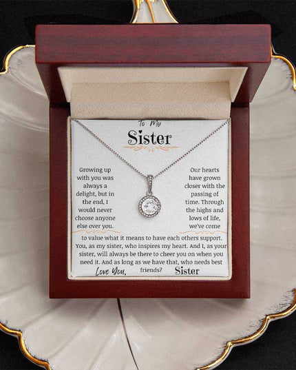 a eternal hope necklace up close in a mahogany box on a coffee filter