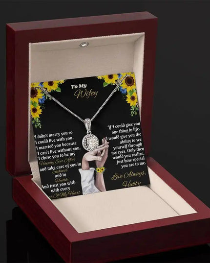 white gold eternal hope necklace in mahogany box angled left