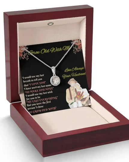 white gold eternal hope necklace in a mahogany box angled left