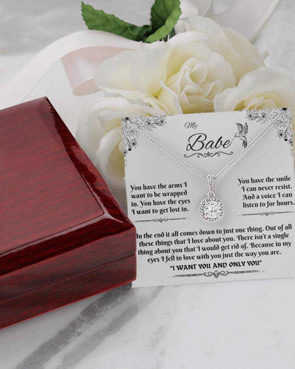 eternal hope necklace on a message card outside of a closed luxury box