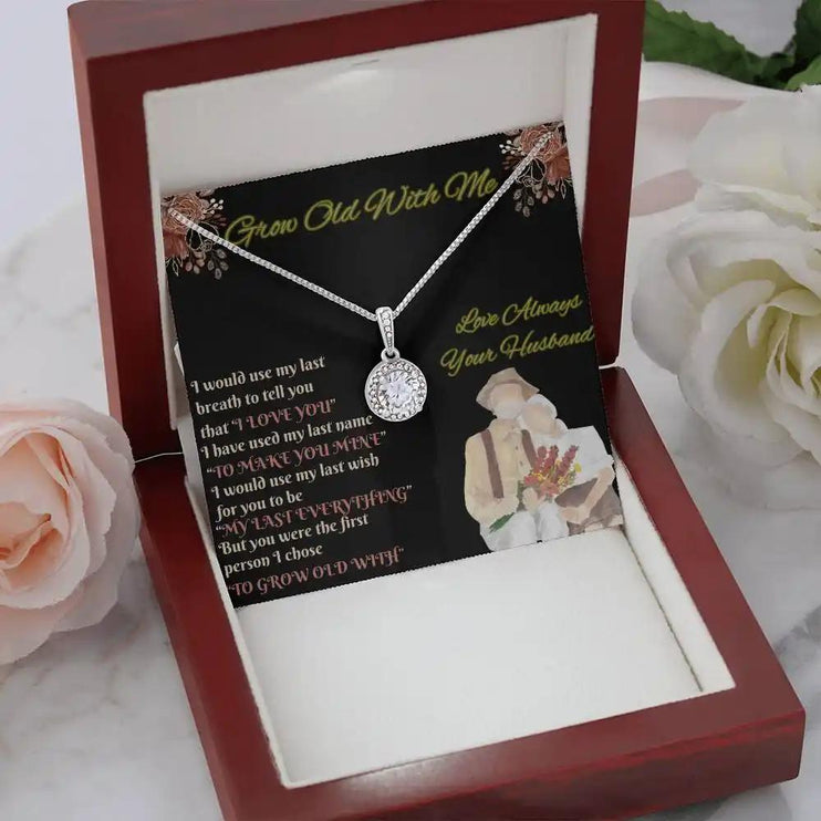 white gold eternal hope necklace in a mahogany box angled left