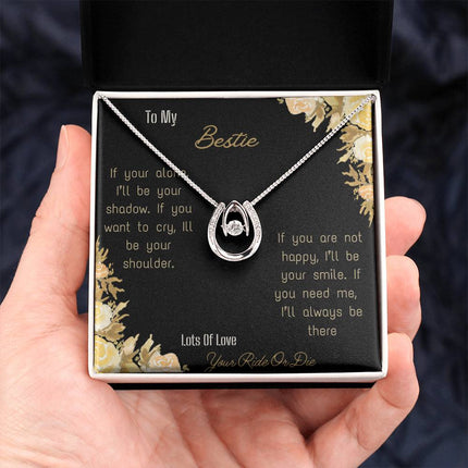 lucky in love necklace with greeting card for bestie in two tone box holding in hand