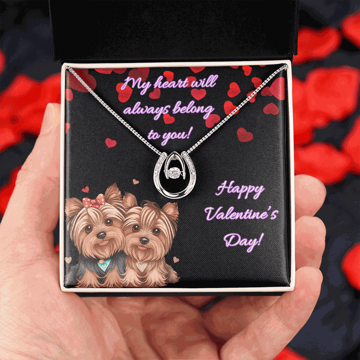 lucky in love necklace in a soft box in a model's hand