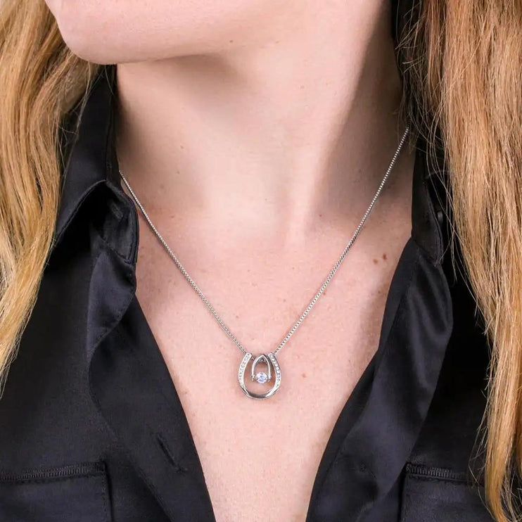 white gold lucky in love necklace on a model's neck