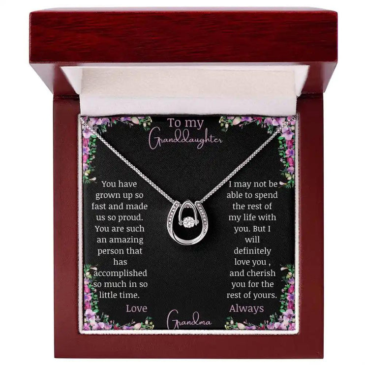 Lucky In Love Necklace with a white gold charm with a to granddaughter from grandma greeting card in a mahogany box 
