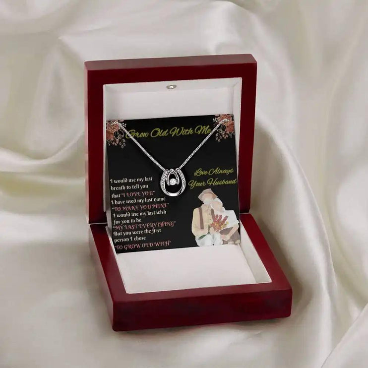 white gold lucky in love necklace in mahogany box on white cloth