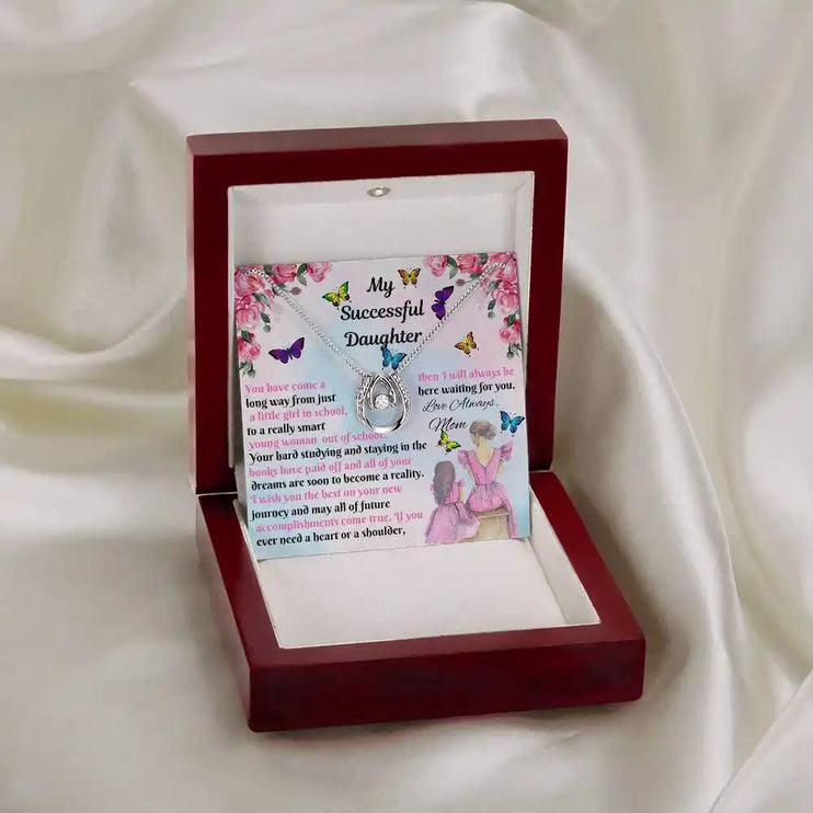 white gold lucky in love necklace in mahogany box on white cloth
